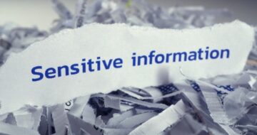 a piece of paper with the word sensitive information on it