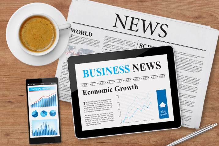 a phone and table with news content