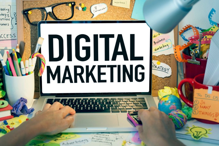 a person using a laptop with the words digital marketing on it