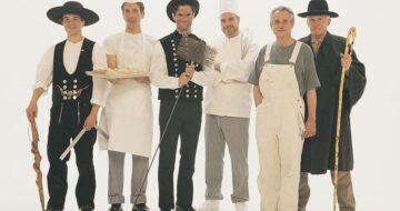 a group of men wearing different uniforms, indicating they work in blue-collar jobs