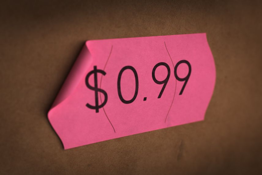 a piece of paper with the price of $0.99 written on it, which is an example of psychological pricing