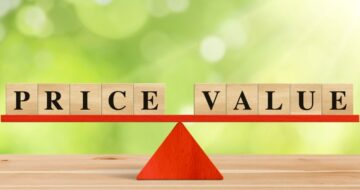 the words price value on wooden blocks on a balance