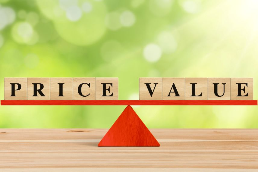 the words price value on wooden blocks on a balance